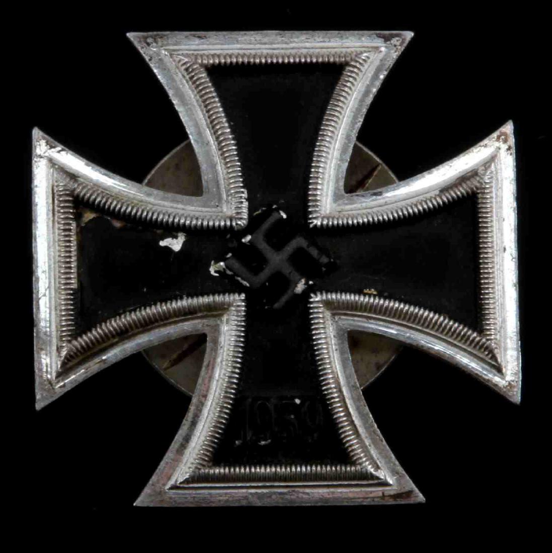 WWII GERMAN THIRD REICH IRON CROSS 1ST CLASS BADGE: In good condition but has black paint loss. Three piece construction with a magnetic core. The back is marked L 54.