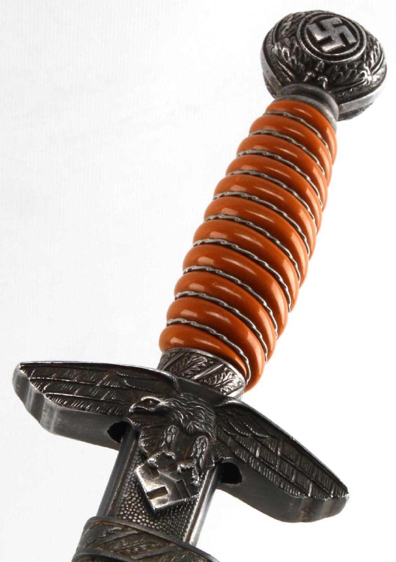 WWII GERMAN THIRD REICH LUFTWAFFE DRESS DAGGER: Dagger and scabbard with 2 suspension rings. Measures 15 1/2 inches long with a 10 inch blade. Etched and named blade. Blade does have some pitting near the tip. Wire wrapped bakelite grip. Marked Ric