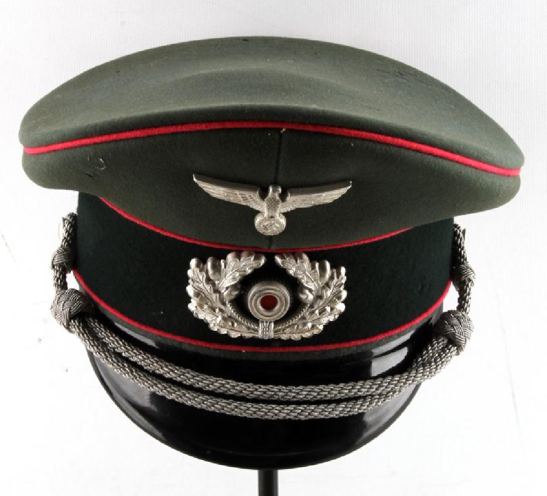 WWII GERMAN THIRD REICH PANZER OFFICER VISOR CAP: The visor cap of Wehrmacht panzer officer. In very good condition, with minor mothing. Has a maker tag inside and a name label 'Soest L'. This lot has a reserve.