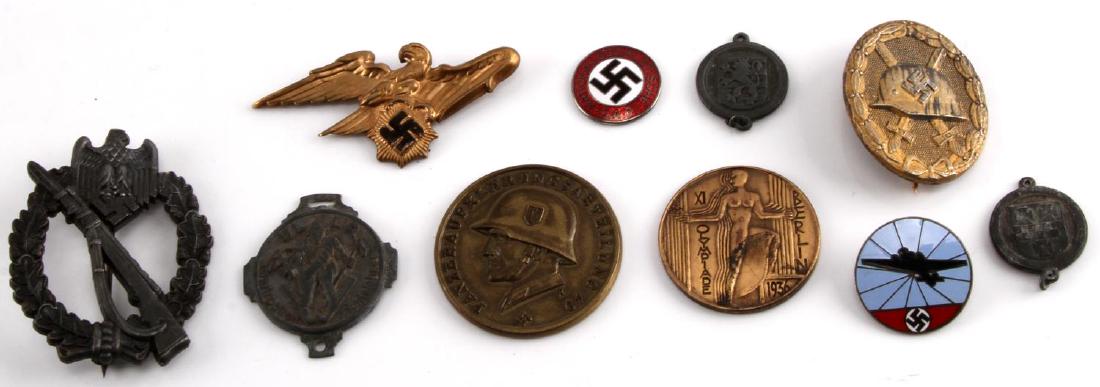 LOT OF 10 WWII GERMAN THIRD REICH BADGES MEDALS: Grouping of 10 WWII German Third Reich NSDAP badges, medals, pins and tinnies including: Gold Wound Badge marked "127" on the obverse, Heer Infantry Assault badge, Olympic Bell medallion 1936, Enamele