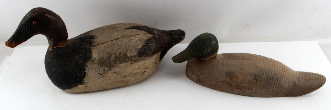 ANTIQUE EARLY DUCK & CANADIAN GOOSE WOOD DECOYS: Victor signed Mallard Duck decoy and an unsigned Canadian Goose. Goose appears to be a repair and possible marriage of head and body. there is a gap in sizing and a newer dowel rod. Both have glass ey