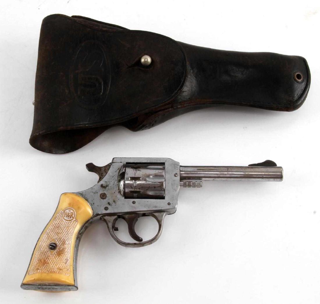 H&R MODEL 923 STAINLESS .22LR REVOLVER W HOLSTER: This is a Harrington & Richardson Model 923 double action revolver chambered in the .22 caliber. The revolver features a stainless 3 1/2" barrel, frame and 9-shot cylinder with an oversized checkered 