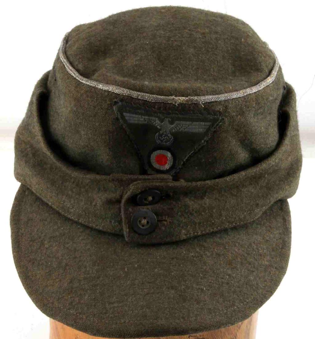 WWII GERMAN THIRD REICH HEER OFFICER M43 FIELD CAP: M43 field cap in green. In good condition. The leather sweatband has mostly degraded and only the front remains. Otherwise in very good condition.