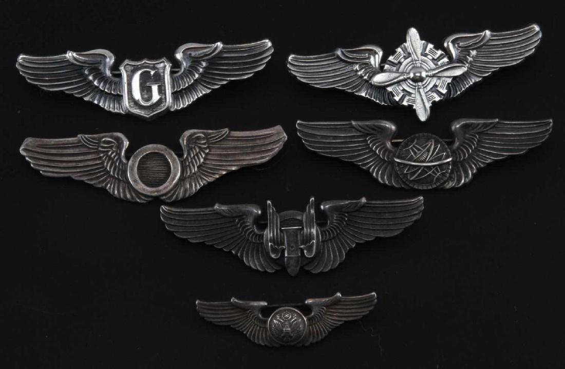 7 U.S. AVIATOR PILOT WINGS MARKED STERLING: Light wear present. overall in very good condition. 6 wings measure to 3 inches and 1 wing measures to 2 inches. Includes Glider, Mechanic, Aerial, and more.