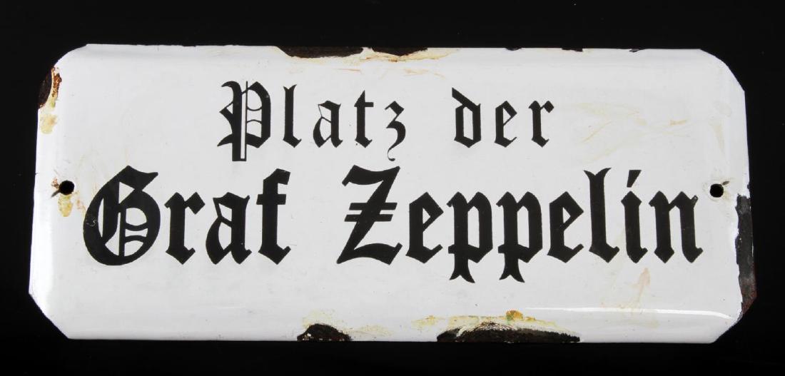 GERMAN WWII PLATZ DER GRAF ZEPPELIN STREET SIGN: Some wear loss of finish present; overall in very good condition. Unauthenticated, sold as is. This lot has a reserve.