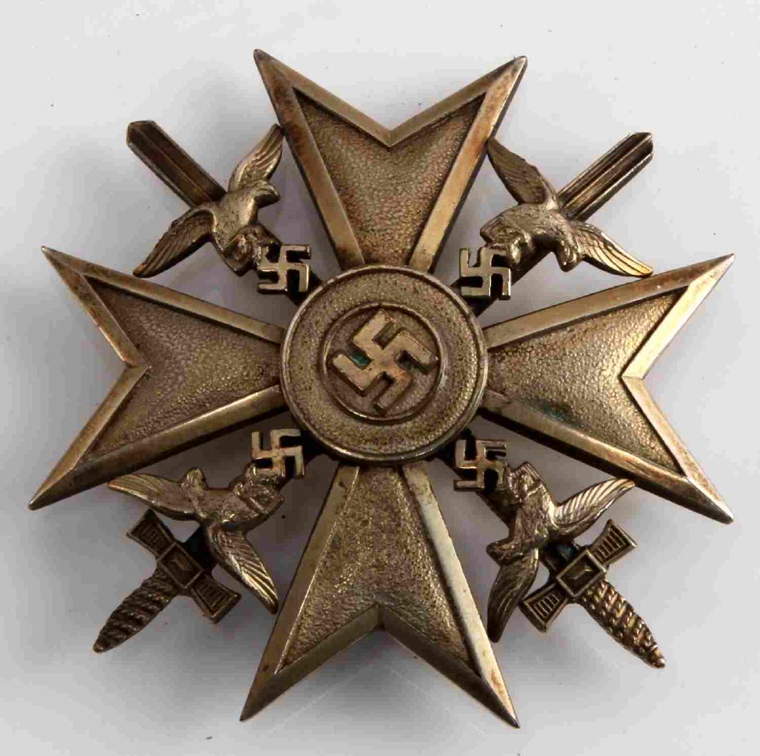 GERMAN WWII GOLD SPANISH CROSS W SWORDS MARKED: Maltese cross with swastika centered design. Four separately applied Luftwaffe eagles in each corner in front of swords. Reverse is maker marked 'GWL' for Gebrüder Wegerhoff - Lüdenscheid. Features