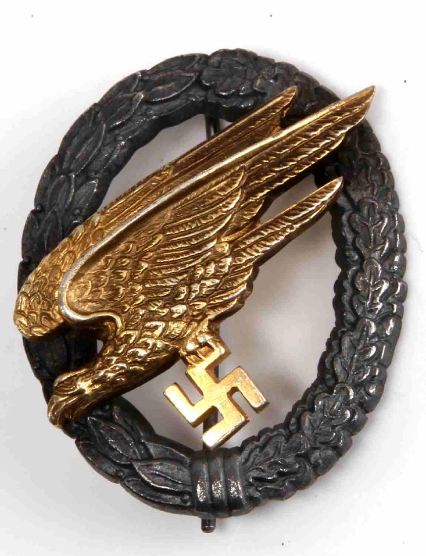 GERMAN WWII LUFTWAFFE PARATROOPER JUMP BADGE: Fallschirmjager Jump Badge in very good condition with minor contact wear marked on reverse "GHO sang Dresden", T bar style pin back and two piece domed rivet construction in nickel and brass. Measure