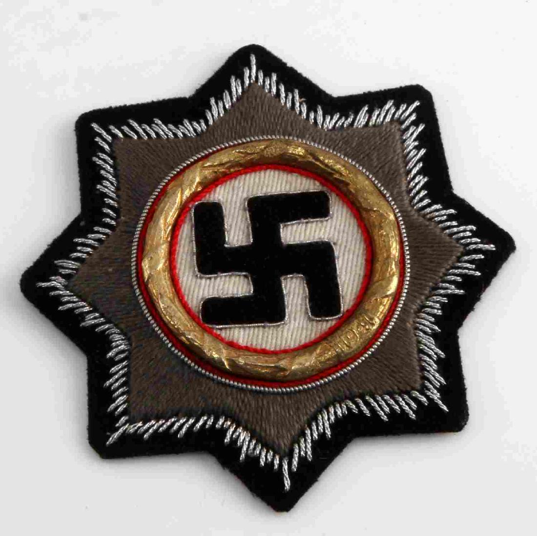 WWII GERMAN THIRD REICH PANZER GERMAN CROSS GOLD: German Cross in Gold with panzer black backing. Black paper on the reverse. Silver bullion wire and cotton machine embroidery on black wool background. In very good condition. Some sections of the thr