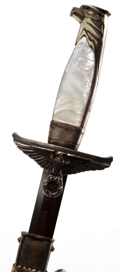 WWII GERMAN THIRD REICH DIPLOMAT OFFICER DAGGER: Dagger and scabbard with 2 suspension rings no hanger. Measures 15 3/8 inches long overall. Blade is marked P D Luneschloss Solingen. Has helmet with sword logo. Cross guard and eagle head pommel are 