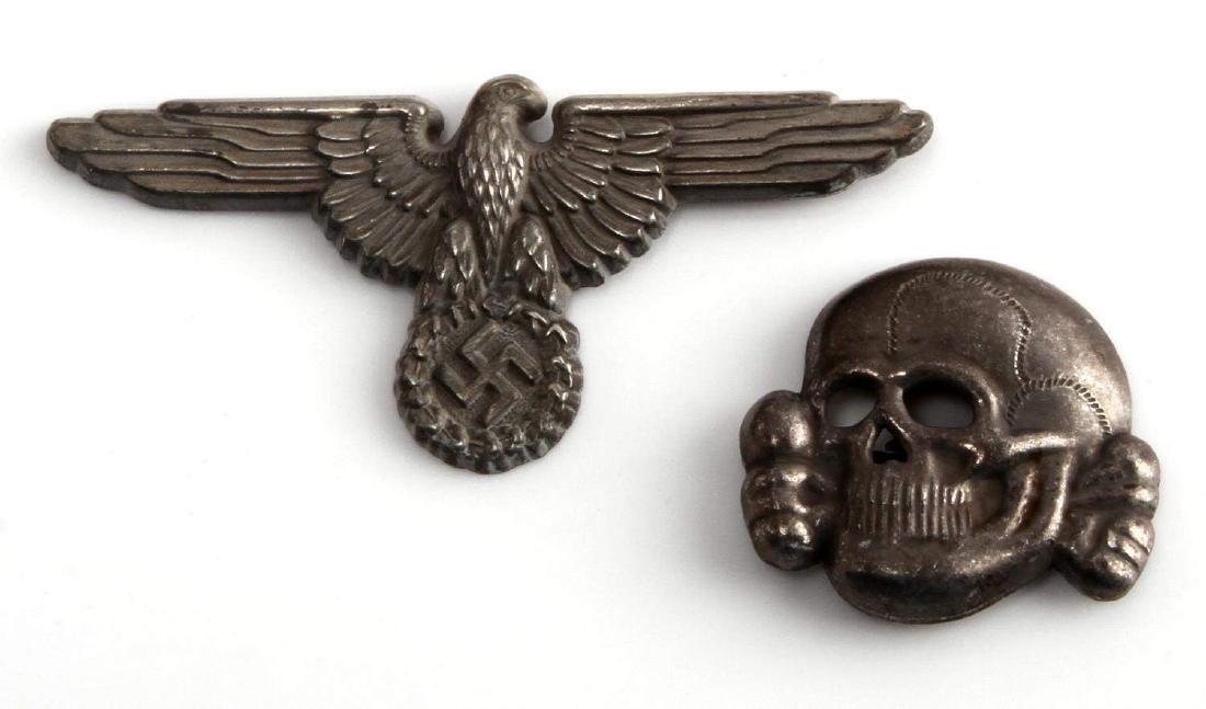 WWII GERMAN THIRD REICH SS VISOR EAGLE & TOTENKOPF: Each has 2 flat horizontal prongs. The reverse on each is marked RZM M1/52. Stamped silver plated nickel construction.