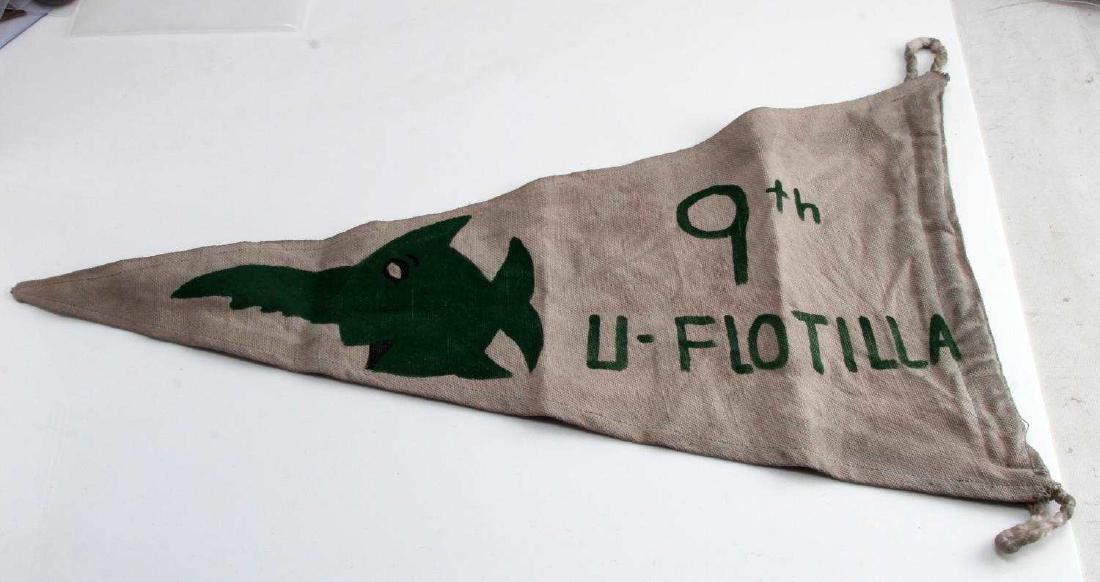 WWII GERMAN THIRD REICH U BOAT FLOTILLA KILL FLAG: Kriegsmarine U-boat flotilla kill flag. Measures 20 1/4 inches in width by 11 3/4 inches tall. The front shows a hand-painted swordfish and reads "9th U-Flotilla" in green paint. Has two rope eyelets 