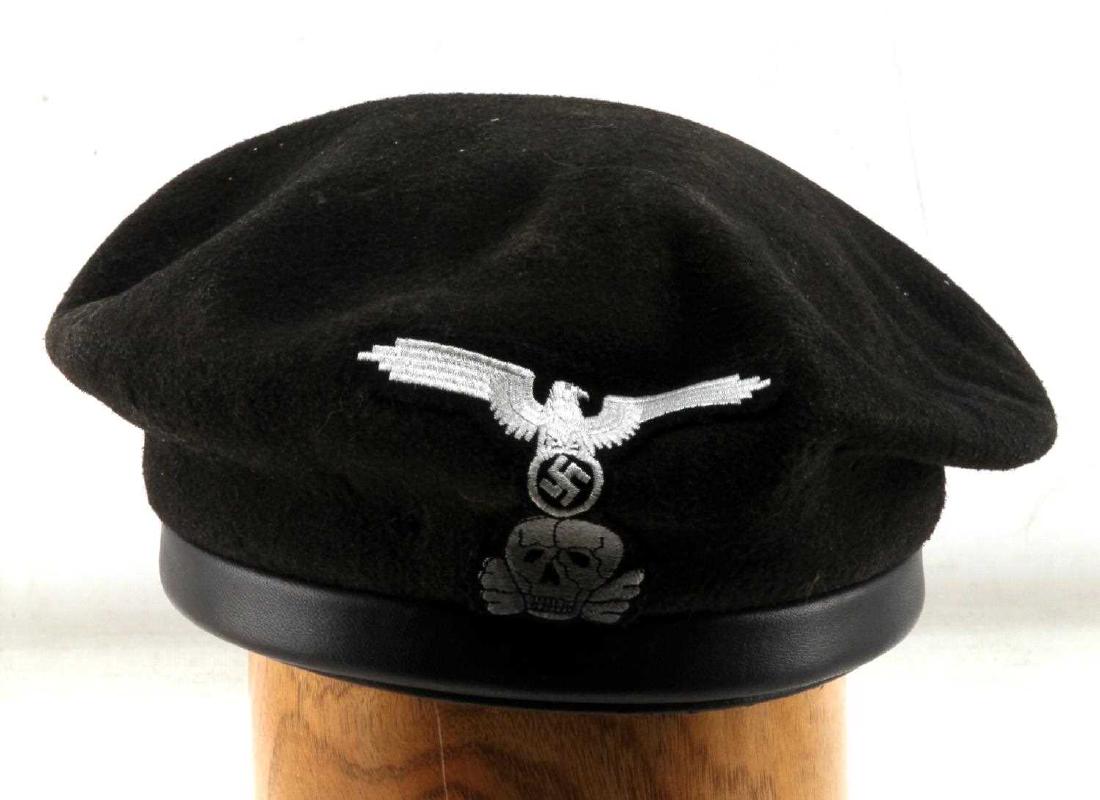GERMAN WWII WAFFEN SS PANZER TANK KORPS BERET: German WWII Waffen SS Panzer Tank Korps hard beret. Top is a black wool with eagle and skull on face. Inside has light green multi piece cotton lining along with grey leather sweat band covering the h