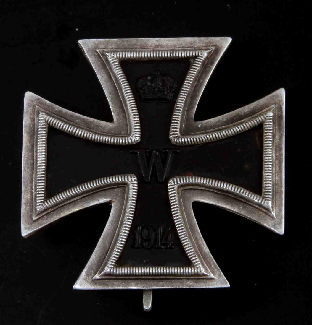 IMPERIAL GERMAN WWI 1ST CLASS IRON CROSS MEDAL: Reverse maker marked "WAS" inside their logo for the manufacturing firm of "Wagner & Sohn Berlin". Wide vertical pin back. Three-piece construction with an iron magnetic center. Unauthenticated. Sold 