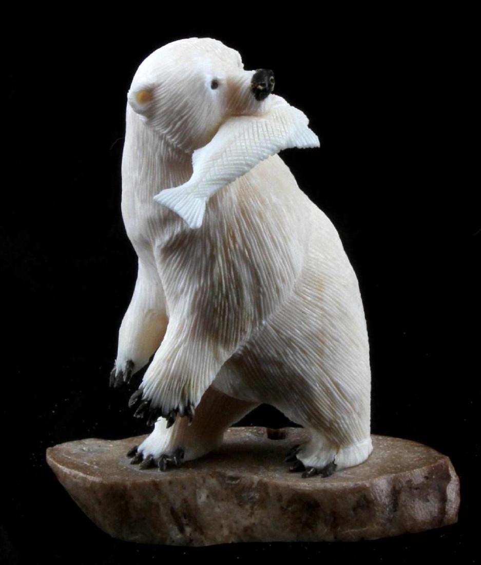 ANINGAYOU ALSKAN NATIVE CARVED WALRUS POLAR BEAR: Signed by James Aningayou on underside mounted on antler, in good condition, measures 4.5x3.5x2 inches.