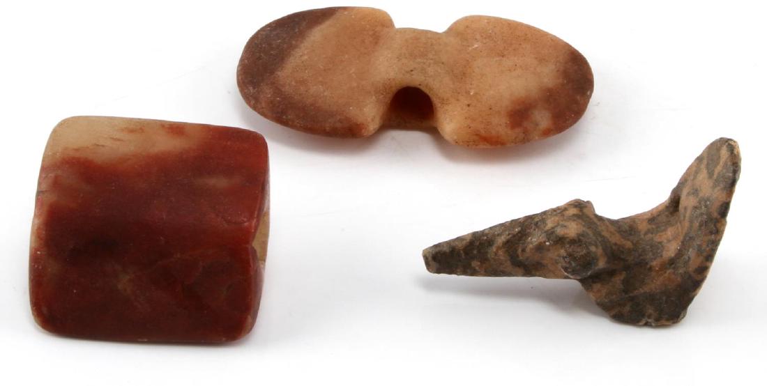 NATIVE BANNERSTONE LOT WITH POPEYED BIRD STONE: Artifacts lot Bird stone measures 3.25 inches in length, heavily pitted with two entrance exit holes on base, Banner stones: Wing 4.4 by 2.25 inches (chipped), Saddle 2.5 by 2.5 inches.