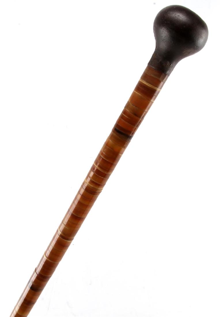 ANTIQUE HORN DISC STACKED METAL TOP WALKING STICK: The metal, door-knob like top makes for a formidable weapon. Original ferrule tip, very nice condition free of distractions, measures 33 inches.