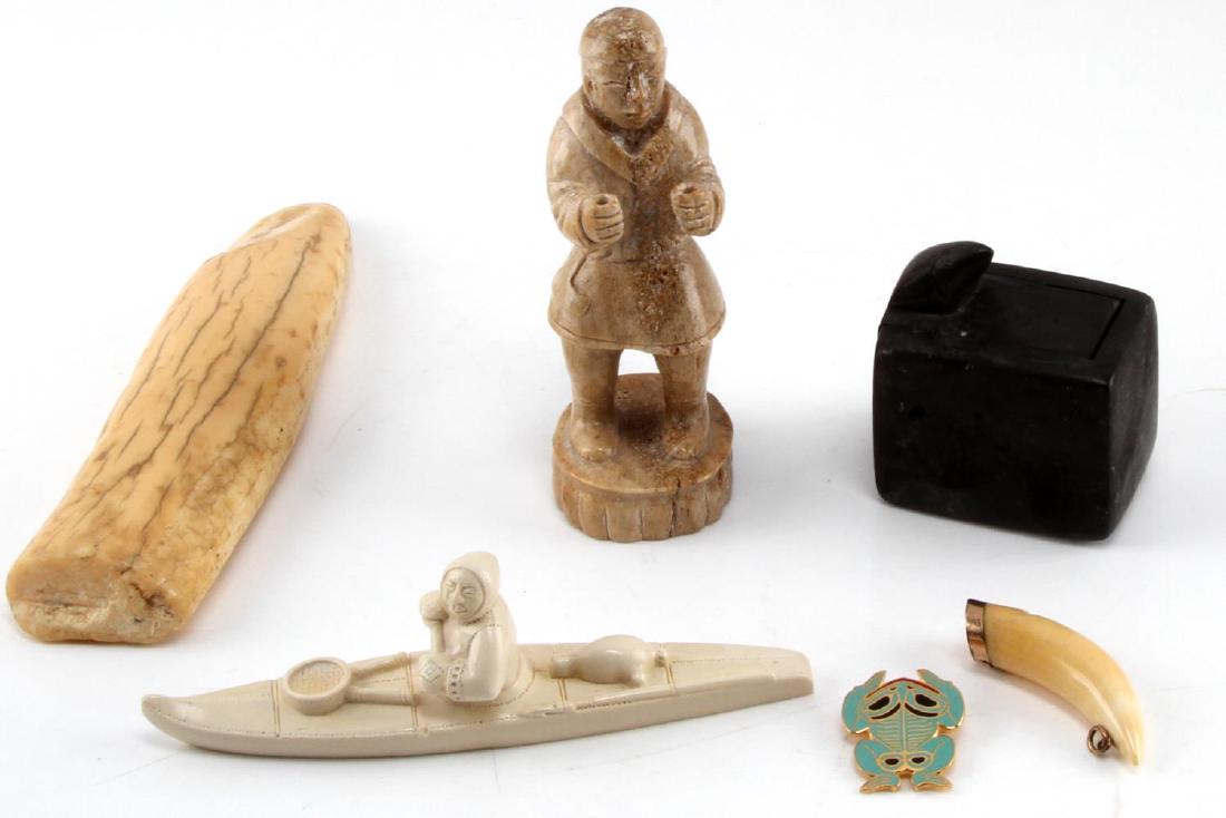 INUIT NATIVE ART SCULPTURE WALRUS TUSK BONE LOT: Collection of Inuit created or inspired items: Bear tooth whistle (2.5 inches on the curve), Inuit man carved from bone (5 x2 inches) appears to be missing something he held. Celluloid sculpture of In