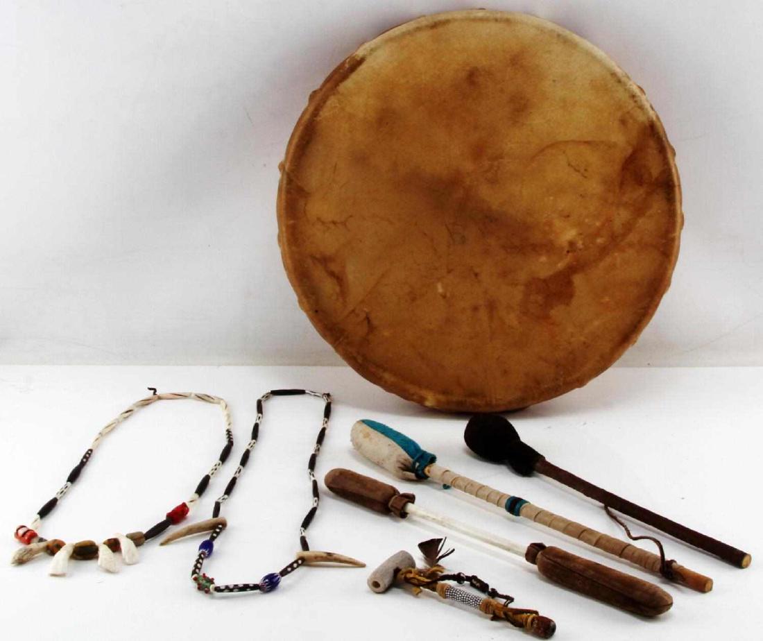 NATIVE AMERICAN HIDE DRUM NECKLACE & PIPE LOT: Parfleche drum measures 16 inches across. Necklaces are made of buffalo teeth, deer antler, bone and glass trade beads, coral and the antler pipe has leather wrap and beadwork. All in very good condit