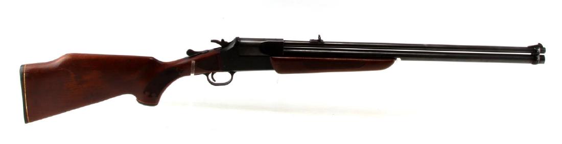SAVAGE 24V OVER/UNDER SINGLE SHOT RIFLE .222 20 GA: Blued steel with 85% remaining, checkered wood stocks, engraved hunting scene to each side plate, serial no. to left side, model marked to right side. Bottom barrel chambered for 3 inch shells. Barrel