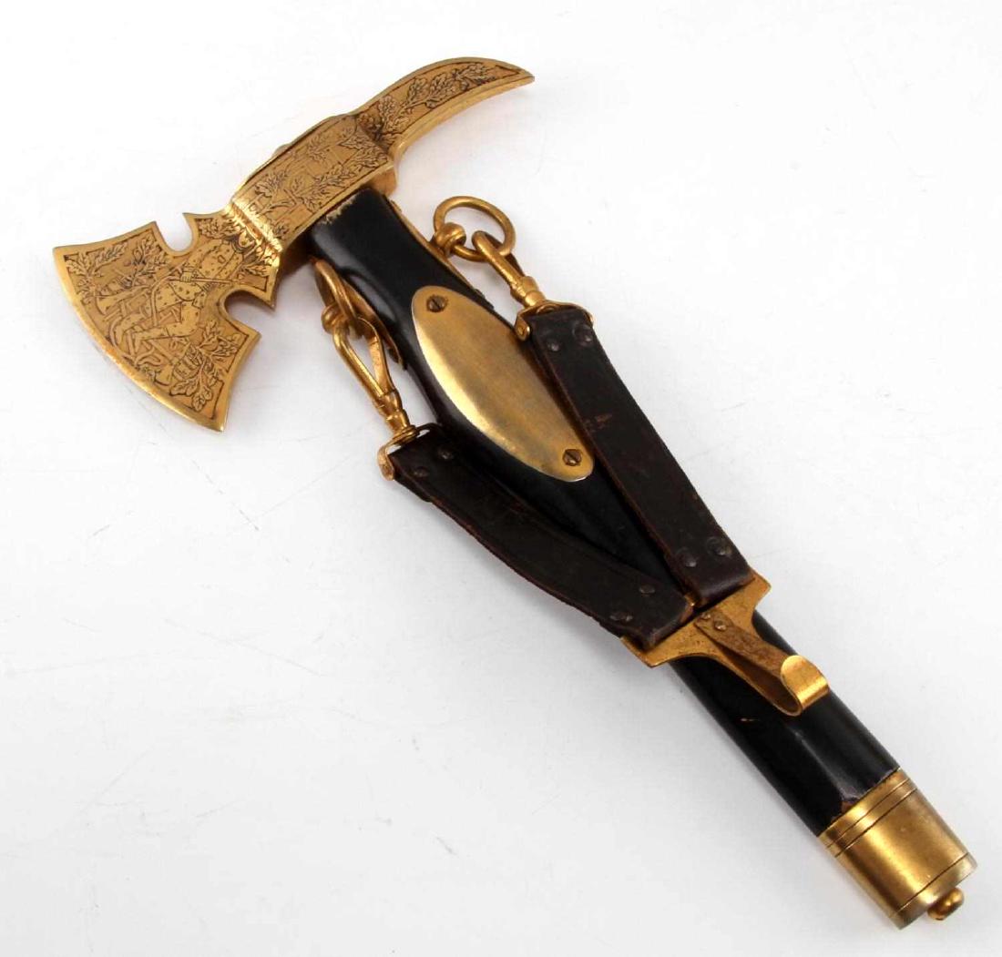 IMPERIAL GERMAN WEIMAR REPUBLIC FIREMAN DRESS AXE: Fireman's dress axe from either Imperial Germany or the Weimar Republic. Measures about 14 inches in length. Has an ebonized wood handle. The axe head has some etched designs, and the brass color has 