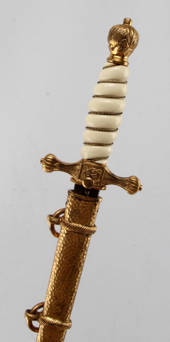 GERMAN THIRD REICH 1ST MODEL NAVY DAGGER ALCOSO: Original Third Reich 1st Model Navy dagger by Alcoso, Solingen. Correct flaming ball pommel, hammered scabbard, and white celluloid grip. Clean blade is engraved to both sides and measures 9 7/8 inche