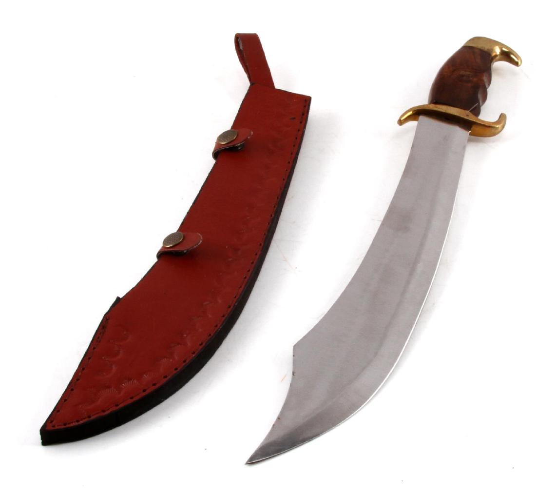 SCIMITAR STYLE WIDE TIP KNIFE AND LEATHER SHEATH: Measures 17 inches with a 13 inch blade. In very good condition but wood handle has a few scratches. Made in Pakistan.