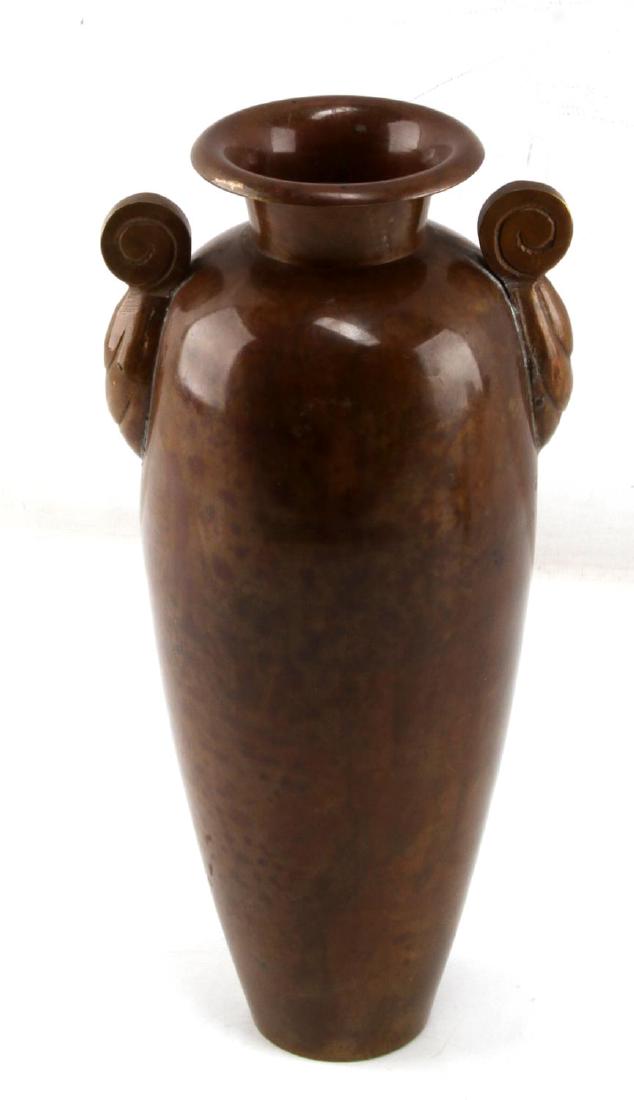 VINTAGE DOUBLE HANDLED COPPER ART DECO VASE: Height 9 3/4 inches with a 4 1/4 inch diameter. Art Deco styling with welded handles. Very nice patina with one scratch on the lip 1 cm long.