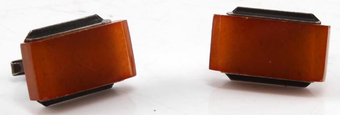 RUSSIAN SILVER & AMBER SOVIET ERA CUFF LINKS: Hallmarked "P" beside a hammer and sickle inside a star next to 875 along with marker marks. They measure 27 by 18 mm each, Amber has some minor chips on edges and a imperfection on the face of one li