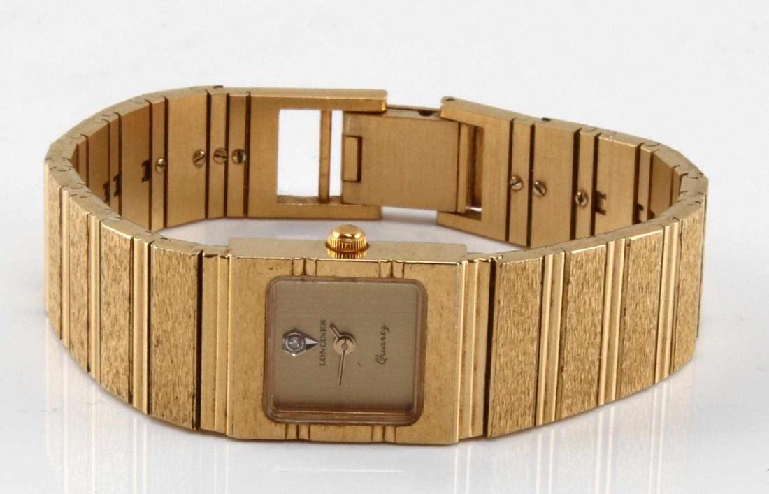 VINTAGE LONGINES LADIES DRESS WATCH WITH DIAMOND: Ladies 1970’s Longines watch with era bark effect gold plated Bracelet, stainless steel bezel and rectangular face with diamond accent. In very good condition, not over wound but will need servicing