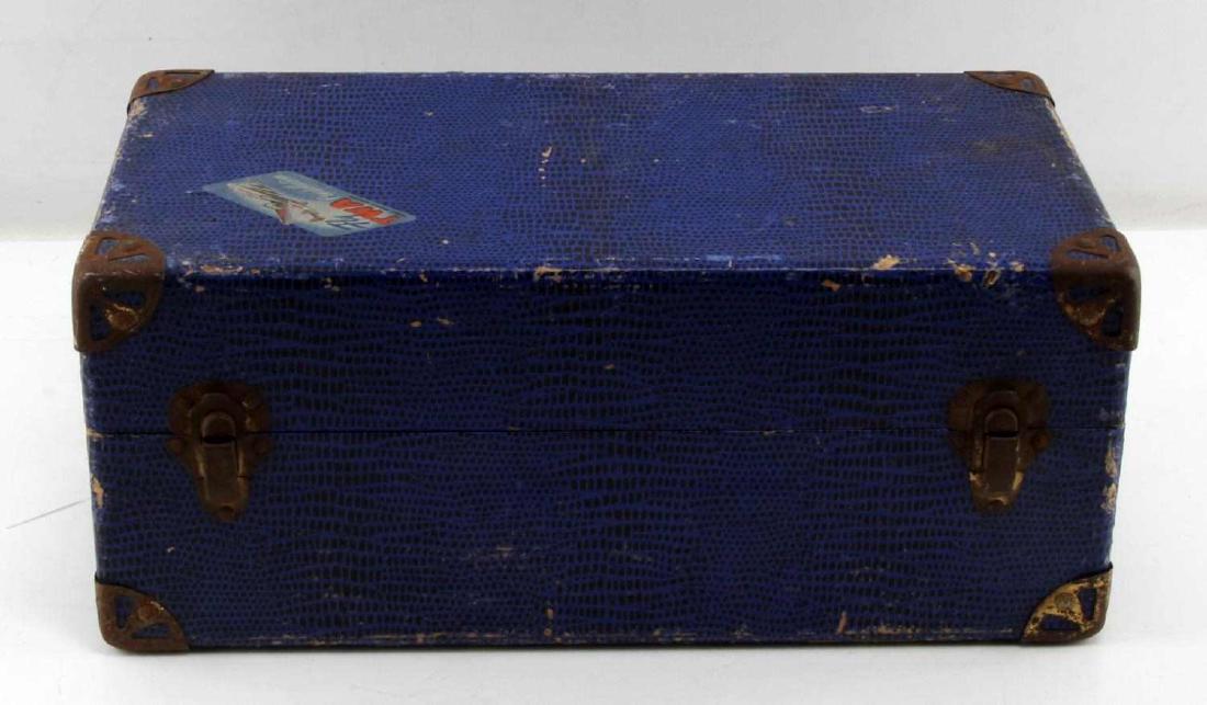 VINTAGE TWA BLUE TOY TRAVEL CHEST W ITEMS INSIDE: A vintage Fly TWA Trans World Airline Constellation blue toy travel chest. Moderate oxidation on corner bumpers. Some cracking and loss of paint to shell. Interior shows elephant/bear/monkey liner. In