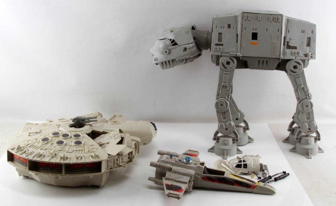 3 VINTAGE STAR WARS TOY LOT FALCON X WING & AT AT: Lot of THREE (3) vintage Star Wars toy lot includes original run of Millenium Falcon (1979), battle damaged X-Wing Fighter (1978), and AT-AT Imperial Walker (1981). All are in good cosmetic condition