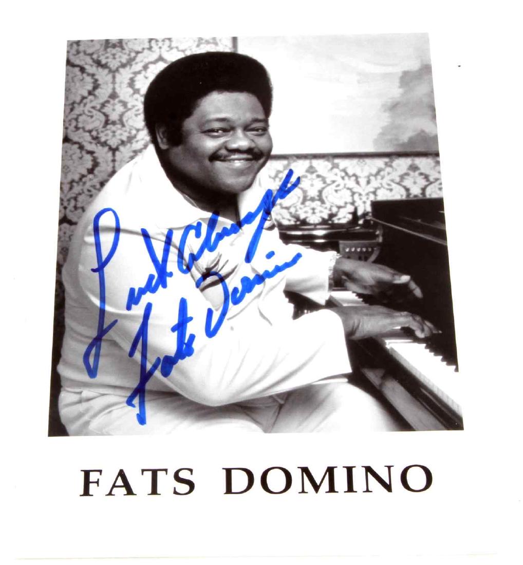 SINGER-SONGWRITER FATS DOMINO AUTOGRAPHED PHOTO: Fats Domino autographed photo. Signed in blue. Picture measures 5" x 7". VG.