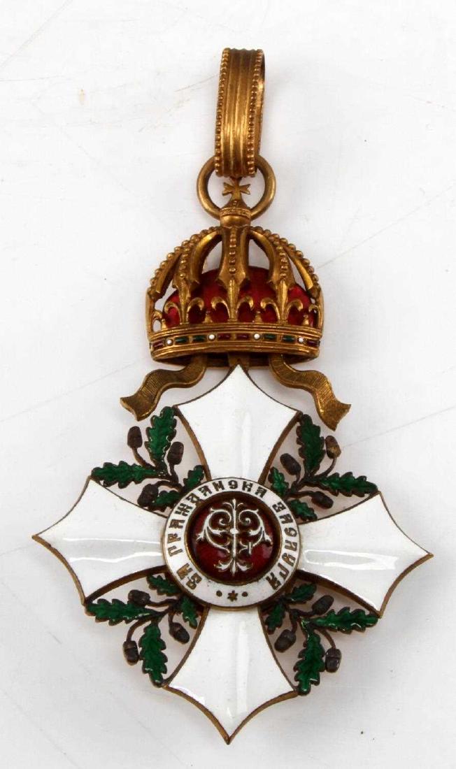 MOUNTED ORDER OF NATIONAL MERIT MEDAL: Mounted Order of National Merit medal. Awarded for outstanding service to the throne. Came in 7 classes. Badge is gold rimmed with white enamel cross. In rikers mount with description card.