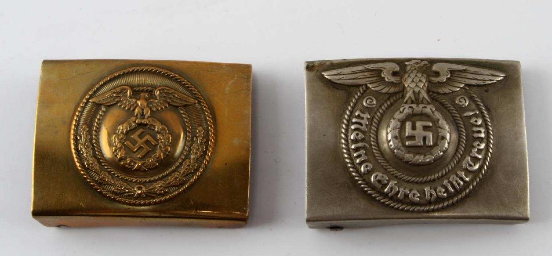 WWII GERMAN WAFFEN SS & DLV RLB LUFTSCHUTZ BUCKLES: Pair of WWII German Waffen SS (silver color) and DLV RLB Luftschutz belt buckle ( brass color) both items are pressed from a thick and high quality metallic alloy. Items are in good condition with no 