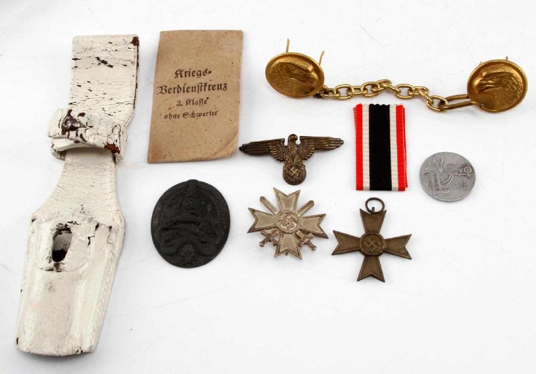 LARGE ASSORTMENT OF WWII GERMAN THIRD REICH ITEMS: Assortment of WWII German Third Reich Items such as medals, ribbons, badges, hat badges and more. Lot includes : White painted leather frog scabbard holder, Maltese cross pendant with 1939 & swastika,