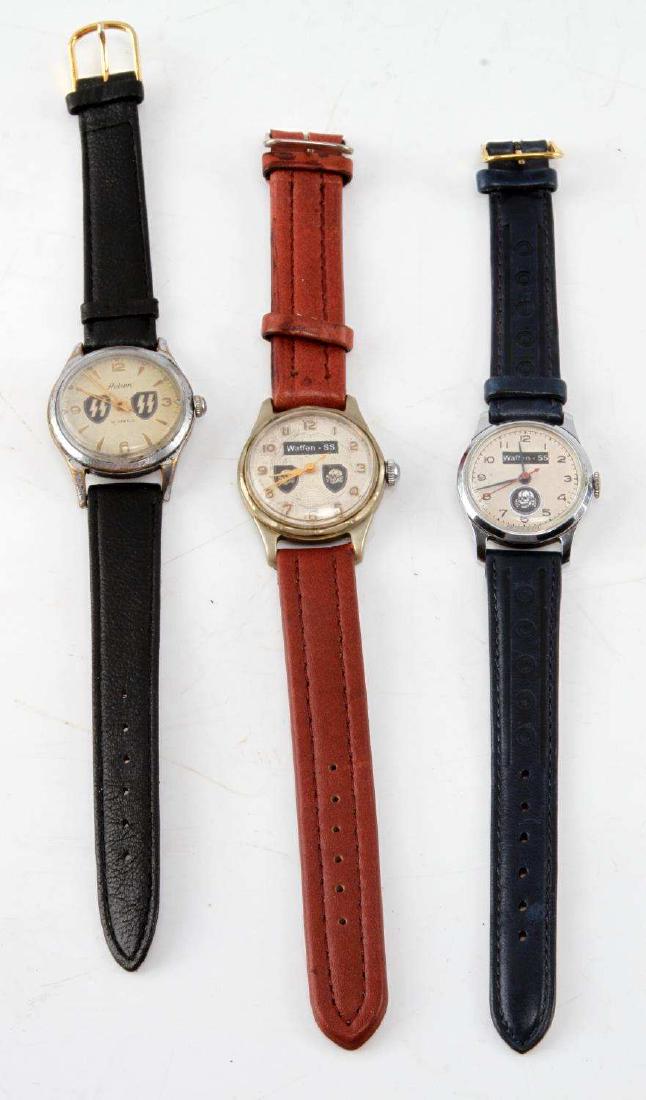 3 GERMAN WWII WAFFEN SS LEATHER WRIST WATCHES: 3 German WWII Waffen SS wrist watches. Each bear a modern replaced leather strap. Faces all display either runes or totenkopf. Non-running. G condition overall. Unauthenticated, sold as is.
