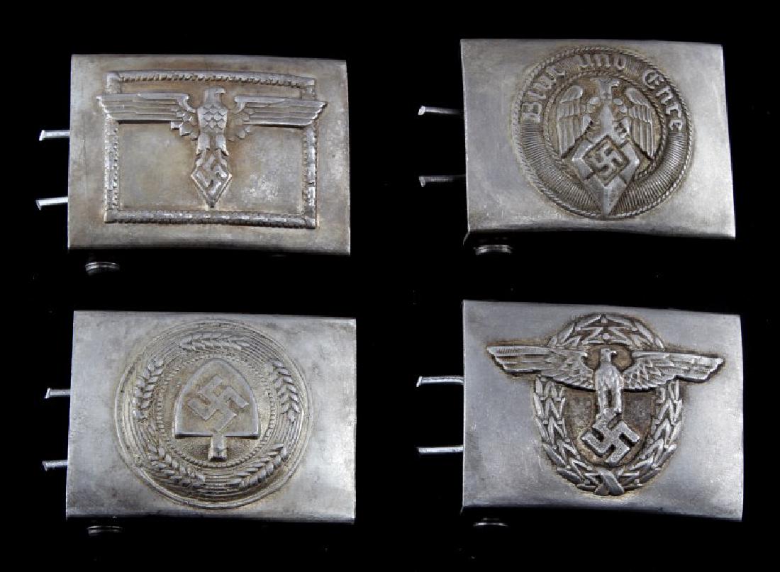 4 GERMAN WWII BELT BUCKLE LOT HITLER YOUTH ETC: Lot of FOUR (4) belt buckles includes: two (2) Hitlerjugend, one (1) Labor Front, and one (1) Police. Each has "RZM" and other markings. Some age wear present. Unauthenticated. Sold "as is". This lot 