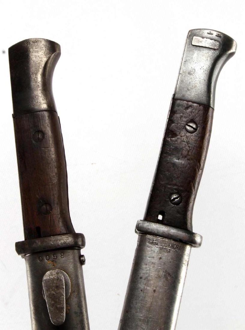 2 WWII K98 BAYONETS 1 MATCHING SERIAL 1 MINT BLADE: One has matching Serial Numbers and date 43, very good blade, dent free scabbard, the second non matching S/N but blade is near mint. EW 100, EW99