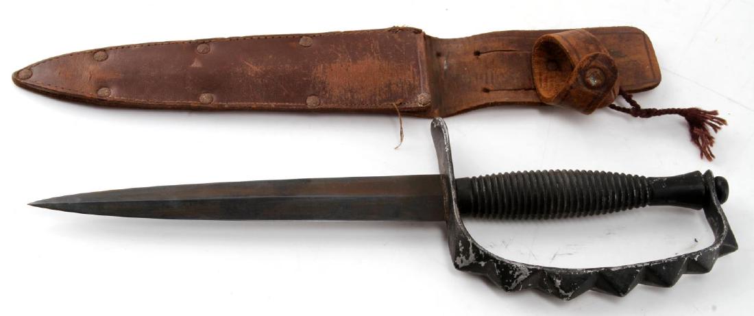 FAIRBAIRN SYKES KNUCKLE DUSTER FIGHTING KNIFE: Unmarked blade and grip, very good blade, grip is one solid piece, with rough leather scabbard. ew137