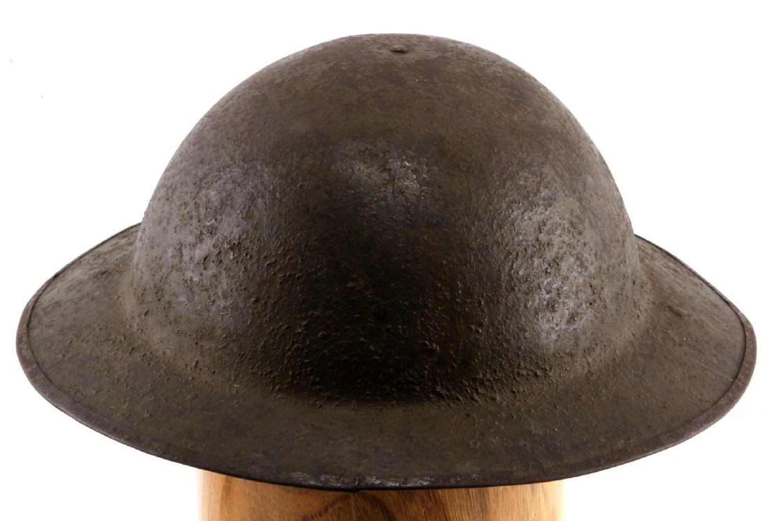 ANTIQUE WWI ERA BRITISH MILITARY DOUGHBOY HELMET: Antique WWI era British Military Doughboy Helmet, marked on the interior of brim with the marking " H-V 528" both swivel bales are present and liner is present and is partially intact. Three fastening