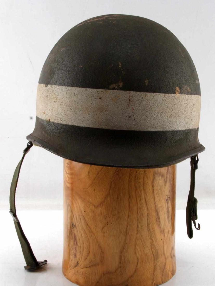 LATE WWII TO KOREA WAR US M1 HELMET WHITE STRIPE: M1 helmet from either late WWII or Korean War. Both helmet and liner have an unbroken white stripe painted around the base. Helmet possibly dates from the US occupation of Japan. In very good overall 