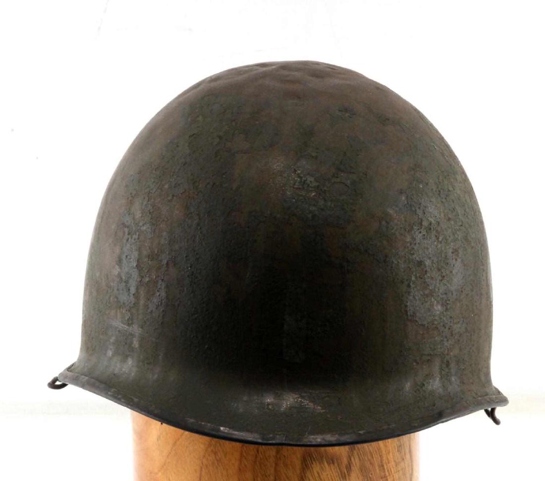 WWII US ARMY M1 HELMET 101ST AIRBORNE MARKING: M1 helmet of the US Army from WWII. Has front seam. Left side has the white painted club symbol of the 327th Glider Infantry Regiment, The back of the helmet has France 1944 painted on. The right side