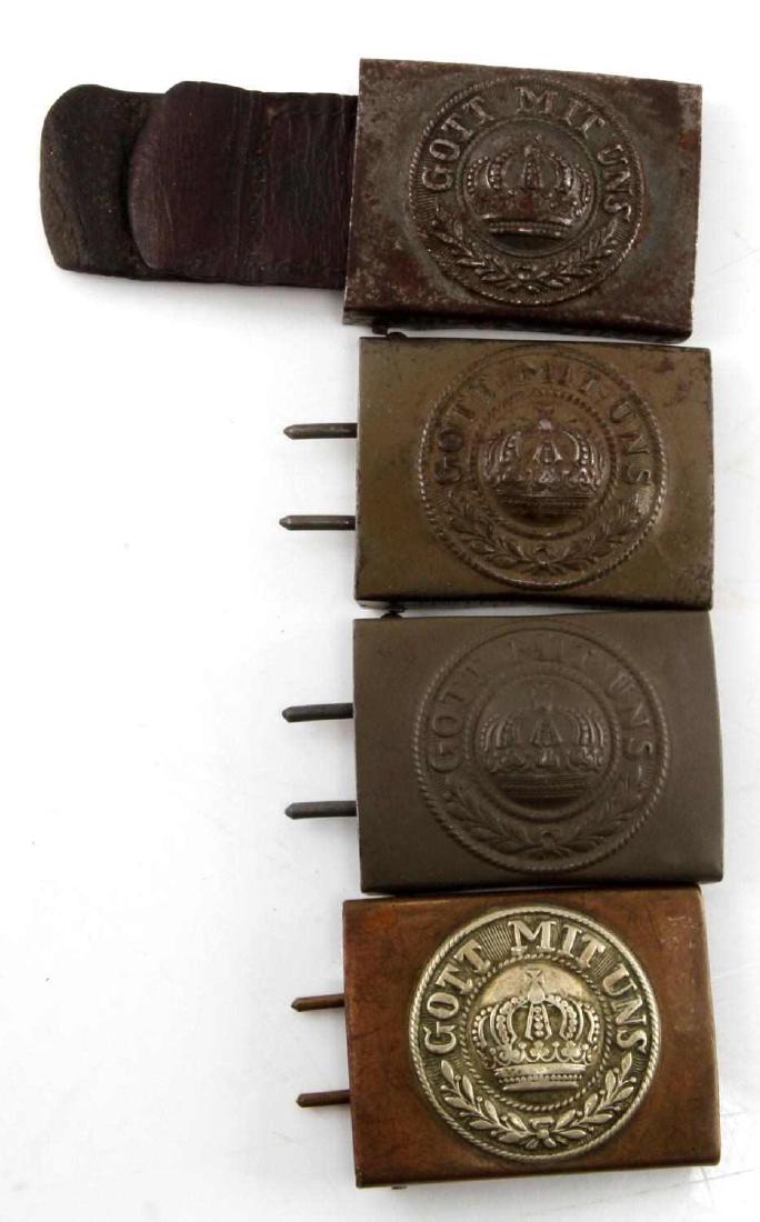 4 WWI IMPERIAL GERMAN GOTT MIT UNS BELT BUCKLE LOT: Lot of FOUR (4). One has part of leather belt attached. One appears to be of brass construction. All in good condition with some tarnish and age wear. #RM16