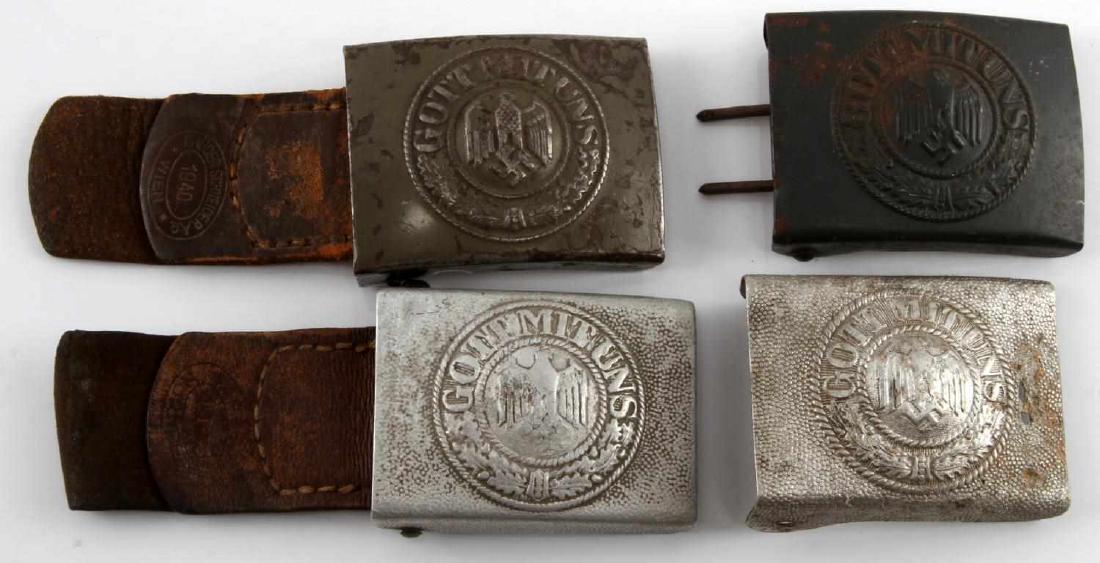 4 WWII GERMAN SS HEER GOTT MIT UNS BELT BUCKLE LOT: Lot of FOUR (4). Two have part of leather belt attached. All are in fair to good condition with tarnish and age wear. One has a few small holes present to surface. Steel construction. #RM15