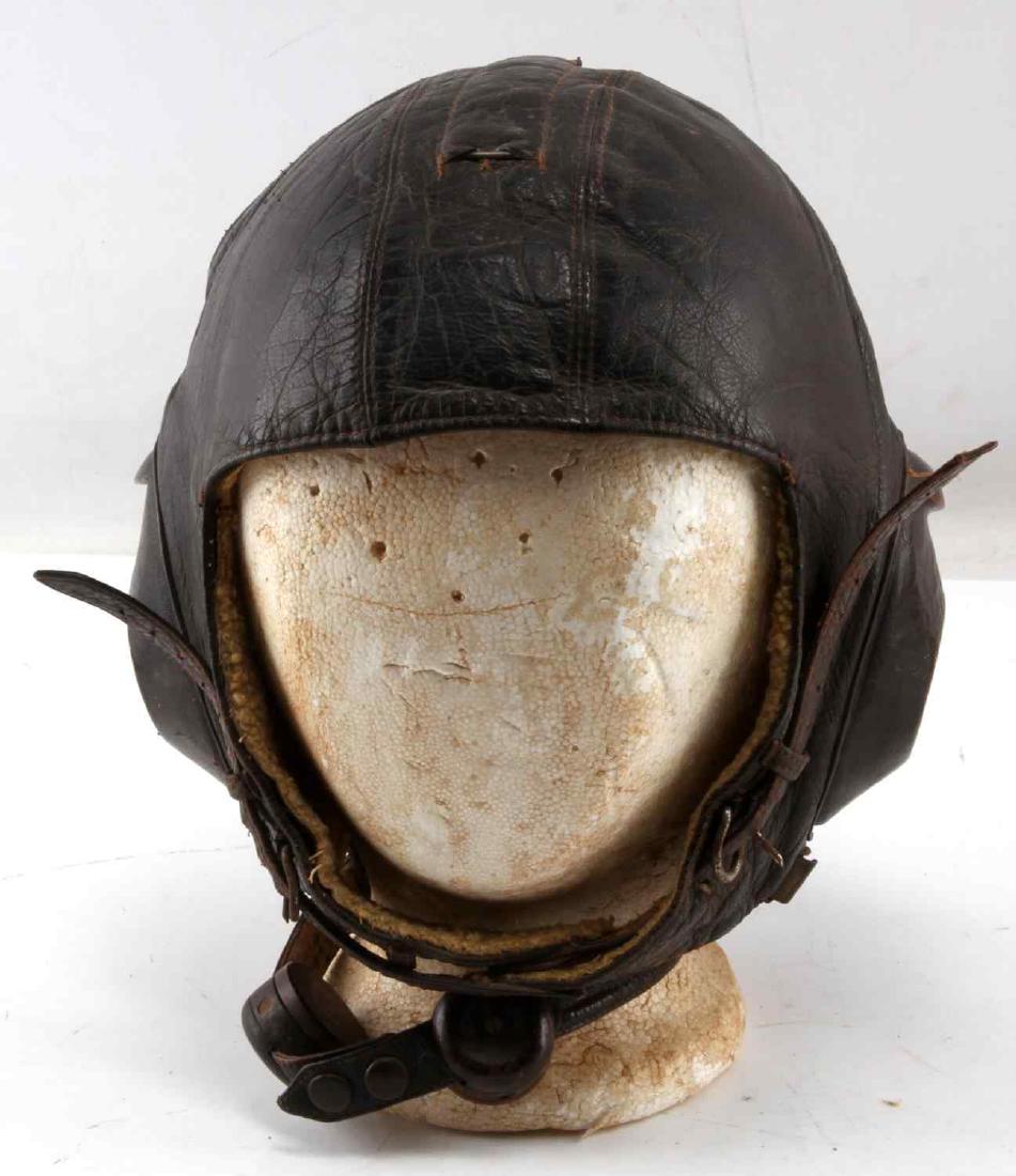 WWII GERMAN THIRD REICH LUFTWAFFE PILOT HELMET: Leather flight helmet of a Luftwaffe pilot. Includes headset and throat microphone. In very good condition Minor wear of the leather. HG139