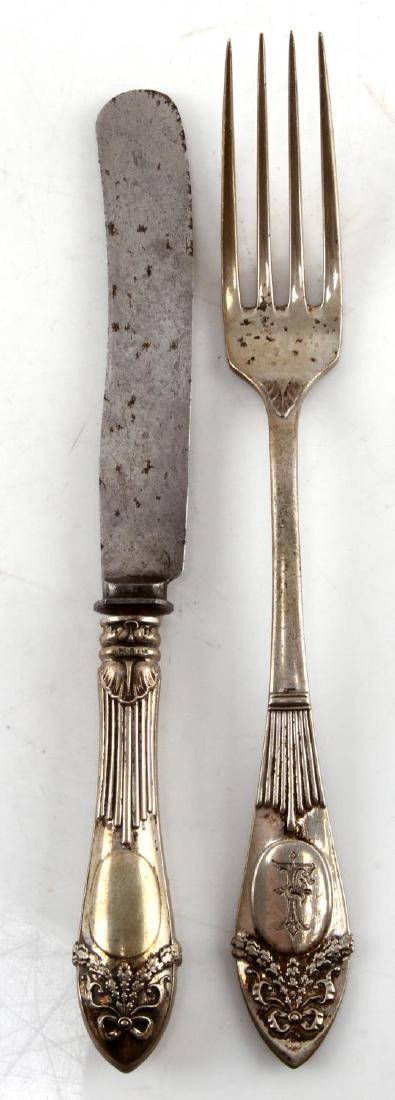 WWII GERMAN FORK KNIFE SILVER SET HANS FRANK SOHN: Hans Frank was an early supporter of the Nazi party and eventually became Hitler's personal attorney. 800 German silver fork and knife set with the letter F engraved at bottom of handle with bow and r