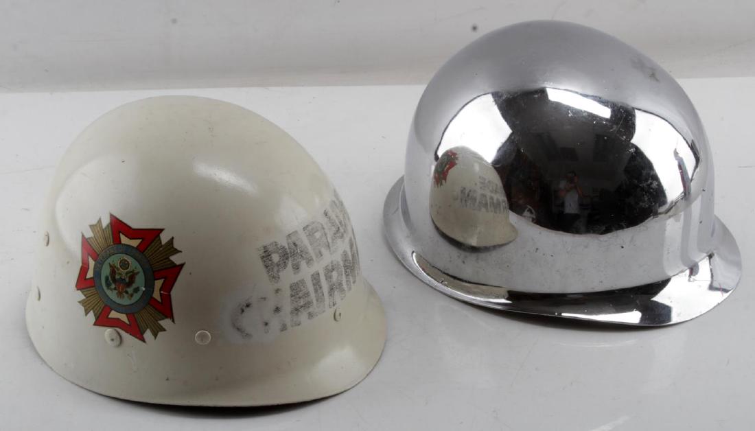 CHROME M-1 SWIVEL BALE PARADE HELMET WITH LINER: Chrome swivel bale M-1 parade helmet with liner and leather chin strap. Some dings and chipping in chrome. Liner marked 'Parade Chairman'. Overall good condition.