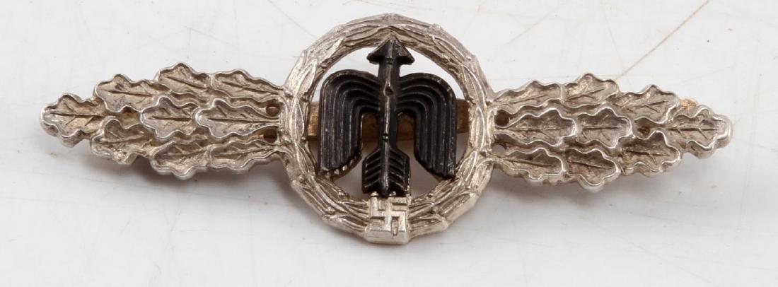 WWII GERMAN THIRD REICH SILVER FIGHTER PILOT CLASP: Silver Luftwaffe fighter pilot clasp. Osang maker mark. Two piece single domed rivet construction and wide pin clasp. In very good condition This lot has a reserve.