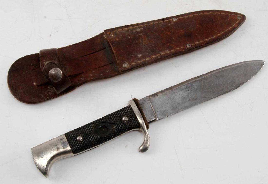 WWII GERMAN THIRD REICH HITLER YOUTH HJ KNIFE: Hitler Youth knife in an atypical leather scabbard. The diamond HJ emblem has been removed from the Bakelite grip. In good condition.