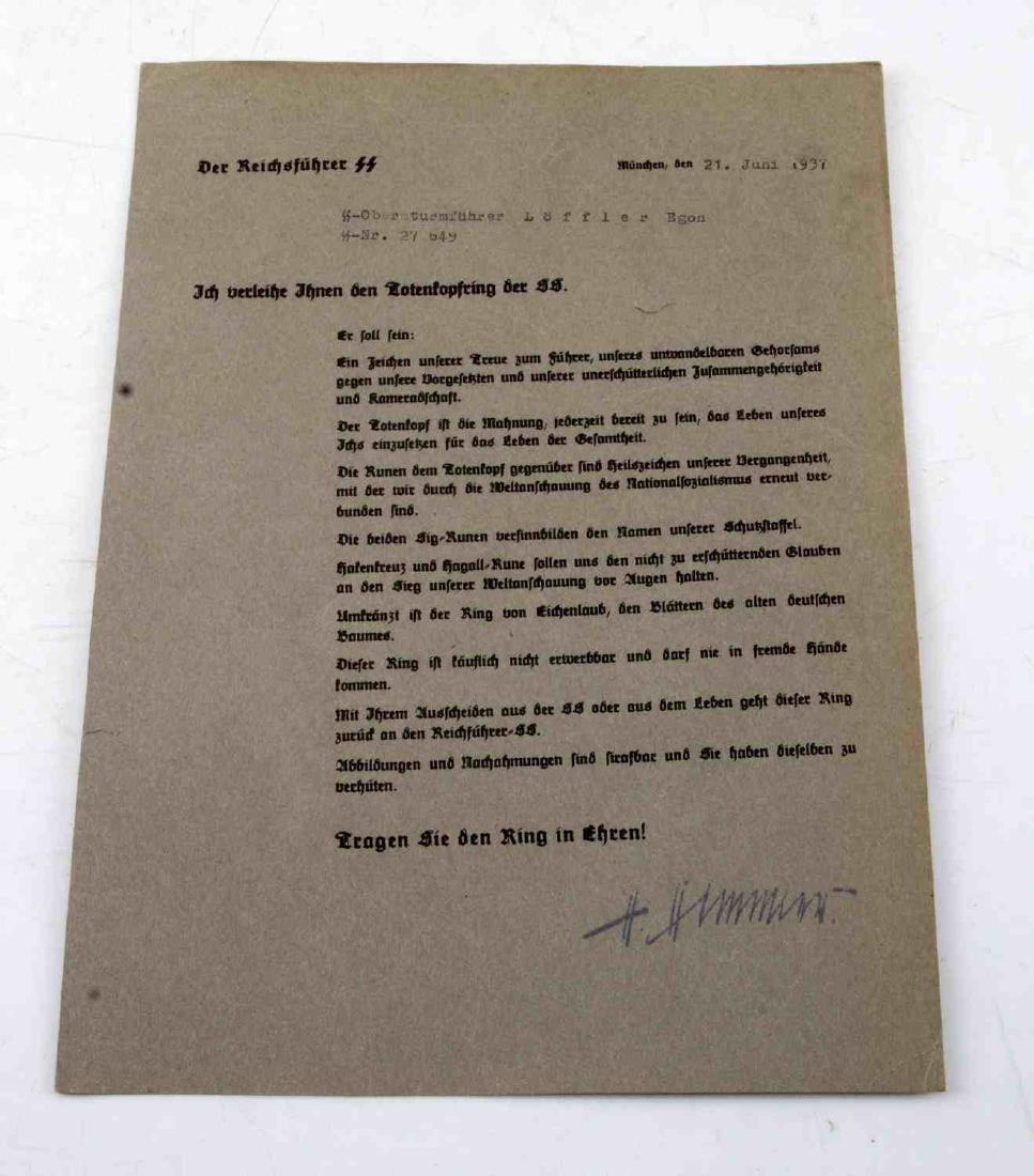 WWII GERMAN THIRD REICH SS HONOR RING AWARDING DOC: German SS document which was drafted to award the SS "Honor Ring." Document is dated June 21, 1937 and is signed by Heinrich Himmler. Document measures 11 and 1/4 by 8 and 1/4" and is in good conditio